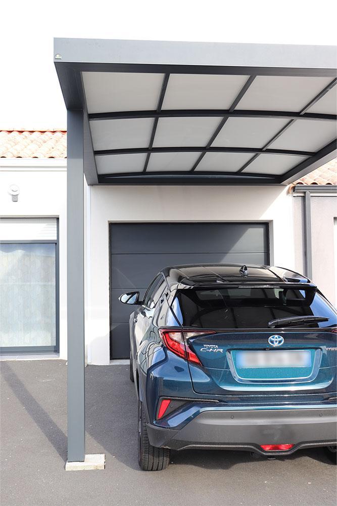 Carport toit cintré adossé